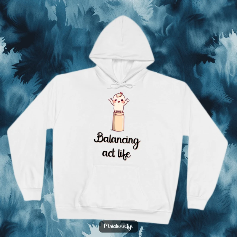 Funny tiny character precariously balancing on a thimble, arms flailing, depicted on a warm and comfortable hoodie.
