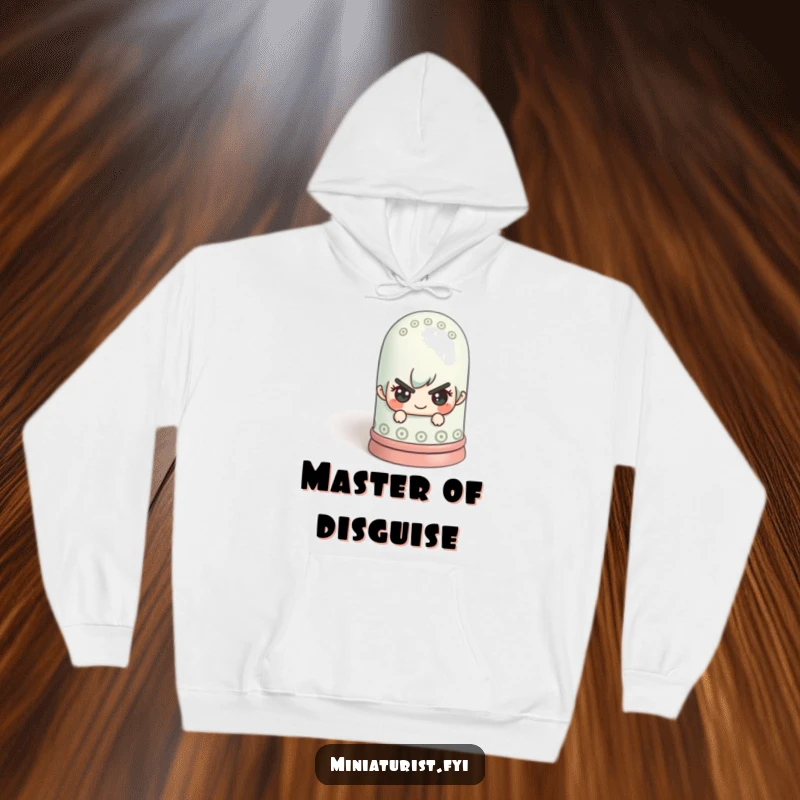 Funny miniature figure with a mischievous expression hiding behind a colossal thimble on a soft hoodie, offering cozy fun.