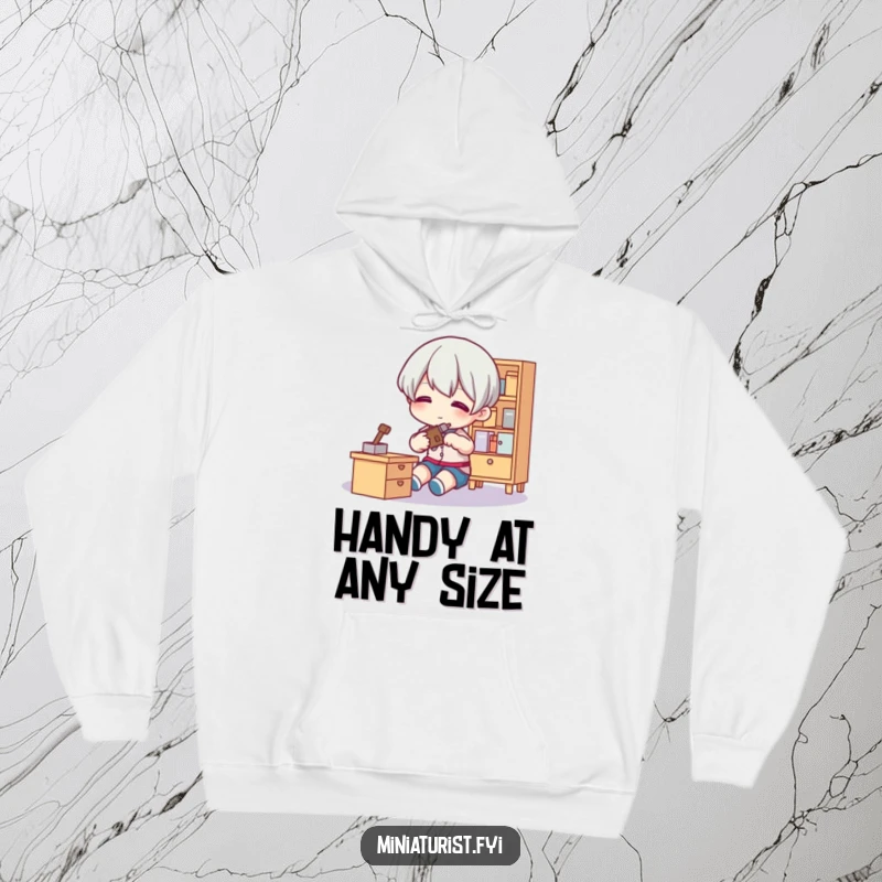 Funny Tiny Fixer Hoodie with a small figure using a tool on tiny furniture, perfect for crafters and humor lovers seeking comfort.