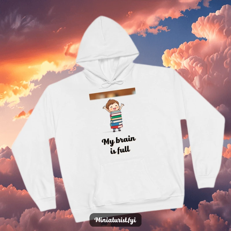 Funny hoodie featuring a small character balancing a precarious stack of tiny books, exuding focus and joyful accomplishment.