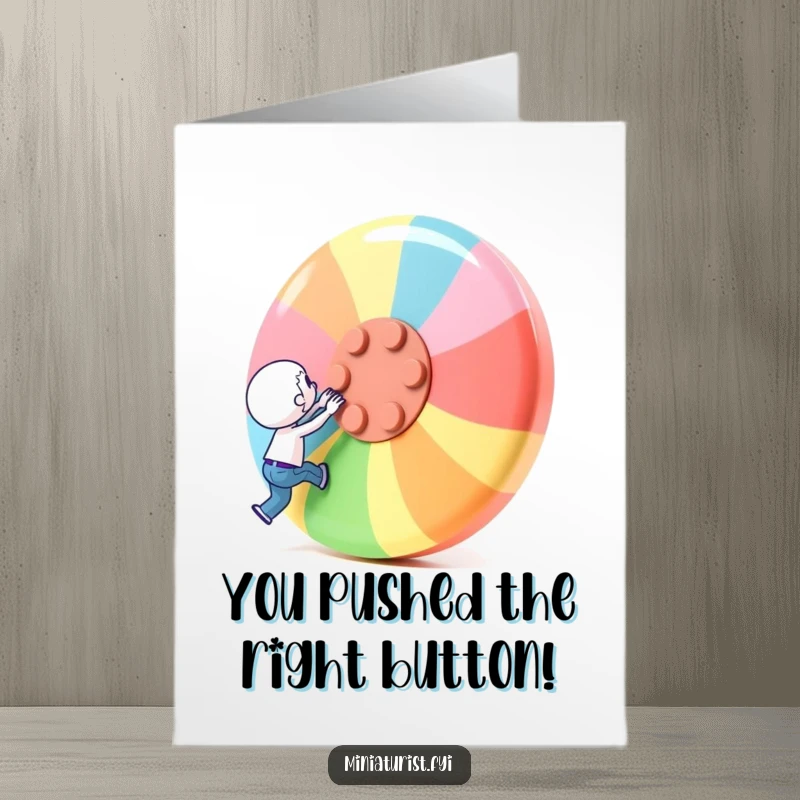 Free Printable Congratulations Card showing a miniature character with all its might attempting to lift a huge, colorful button.